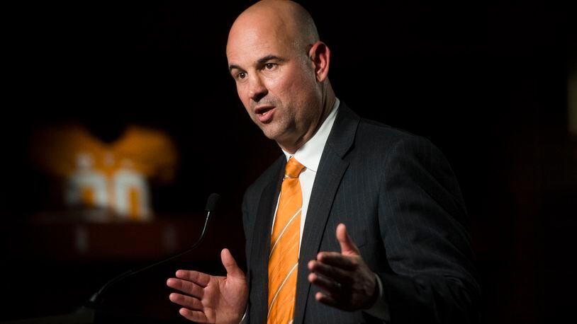 In this Dec. 7, 2017, file photo, Tennessee head coach Jeremy Pruitt speaks at his introduction ceremony in Knoxville, Tenn. Pruitt doesn’t have to split time between two jobs anymore. After serving as Alabama’s defensive coordinator during the Crimson Tide’s national championship run, Pruitt is back in Knoxville beginning the challenge of returning Tennessee to Southeastern Conference contention. (Caitie McMekin/Knoxville News Sentinel via AP, File)