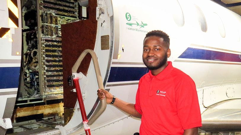 Mugisha “Mo” Kamana of Kigali, Rwanda will graduate from Sinclair Community College Thursday as one of the school's first with a bachelor of applied science degree in aviation technology/ professional pilot. SINCLAIR COMMUNITY COLLEGE