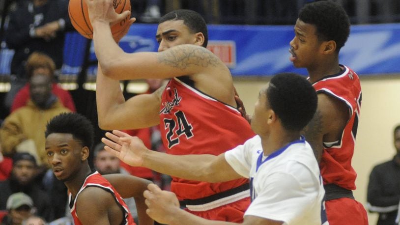 Torrey Patton of Trotwood-Madison (with ball) was named the D-II All-Ohio co-player of the year. MARC PENDLETON / STAFF