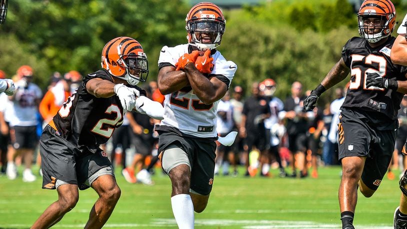 Running back Giovani Bernard carries the ball during the first day of Cincinnati Bengals Training Camp Friday, July 28 at the practice fields beside Paul Brown Stadium in Cincinnati. NICK GRAHAM/STAFF
