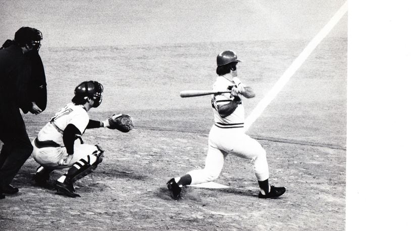 Pete Rose hits a single to right in the 1975 World Series. Rose, a switch hitter, remains the all-time Major League leader in hits with 4,256.