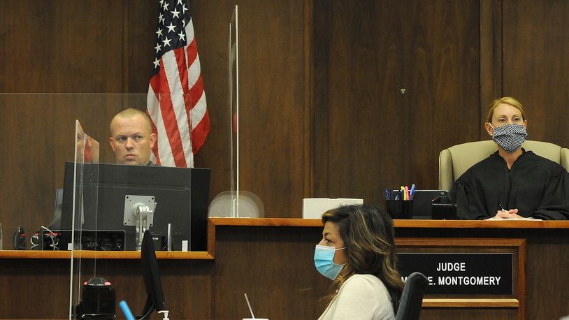 The Montgomery County Common Pleas Court suspended all jury trials for the rest of the year except in cases where unique and unavoidable circumstances are presented. Pictured is a jury trial from June where Montgomery County Common Pleas Court Judge Mary Montgomery presided over a jury trial while wearing a mask. MARSHALL GORBY\STAFF