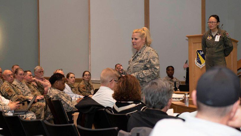Lt. Col. Karen Kramer, 88th Aerospace Medicine Squadron’s Public Health Flight commander, center, briefs the audience during a COVID-19 tabletop exercise on March 11 inside the Wright-Patterson Medical Center auditorium while Lt. Col. (Dr.) Hui Ling Li, installation public health emergency officer and 88 MDG chief of Aerospace Medicine, stands by. Li functions as the base’s ‘incident commander’ during any public health emergency. (U.S. Air Force photo/Senior Airman Emily Rupert)
