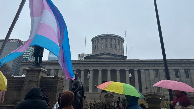 A group of protestors gathered outside the Ohio Statehouse on Wednesday, Jan. 24, 2024, to voice displeasure of the Senate's vote to override of Gov. Mike DeWine's veto on a bill that would bar transgender minors from undergoing gender-affirming care. AVERY KREEMER/STAFF