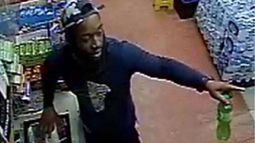 Surveillance video shows a man who would throw a beer bottle at a convenience store clerk.