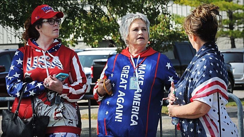 Trump supporters lineup outside near Dayton International Airport Monday morning. MARSHALL GORBY\STAFF