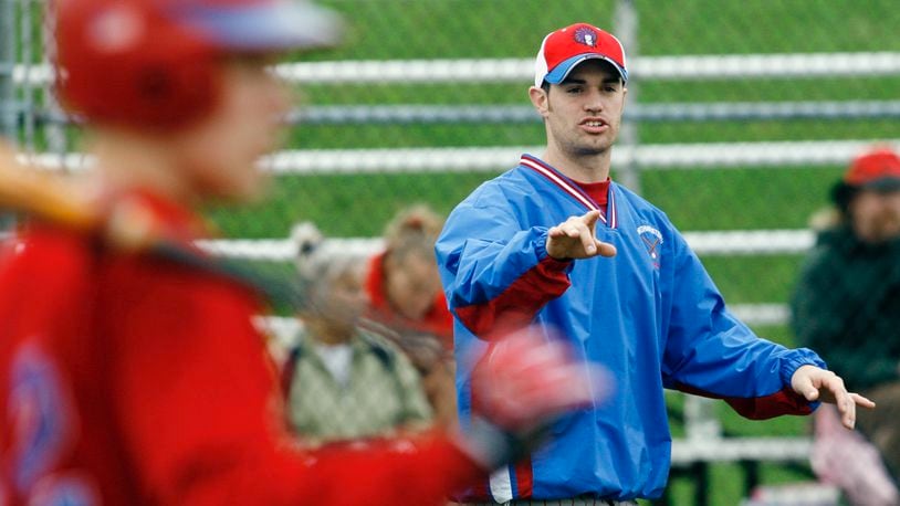 Northwestern head baseball coach Brent Parke offers advice to his players between innings during a game in 2007 at Northeastern High School. Staff Photo by Barbara J. Perenic
