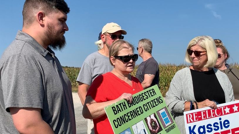Jude Eschete, Lorie Venable, and Pam Gayheart stand across the street from the Dovetail biodigester in Bath Twp. Wednesday after the digester’s parent company Renergy agreed to close the facility Wednesday. LONDON BISHOP/STAFF
