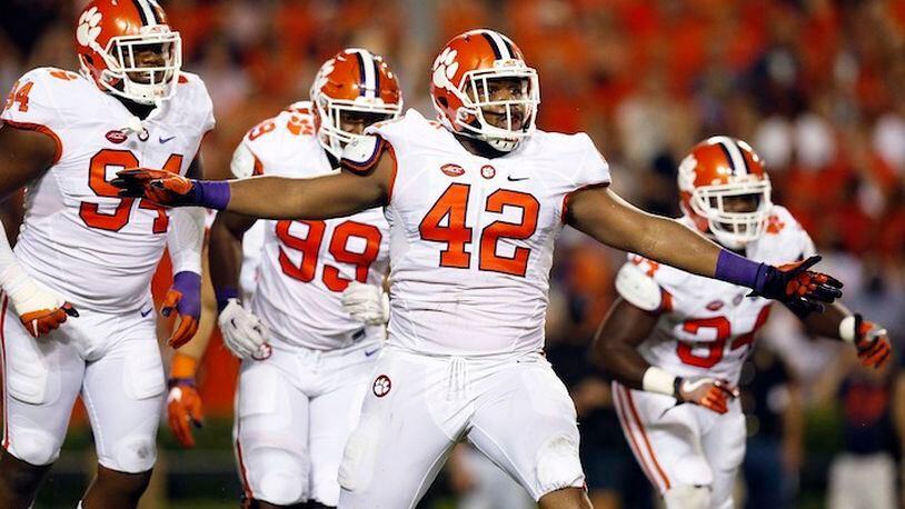 Clemson defensive lineman Christian Wilkins celebrates after a Clemson sack of Auburn quarterback Jeremy Johnson during the first half of an NCAA college football game, Saturday, Sept. 3, 2016, in Auburn, Ala. (AP Photo/Brynn Anderson)