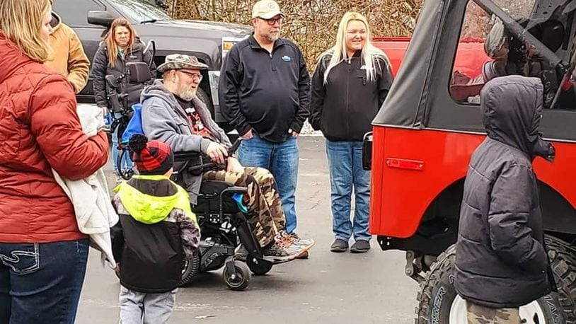 Bill Hammock, an Air Force veteran diagnosed with Lou Gehrig's disease, was surprised Saturday when his rebuilt 1979 Jeep was delivered. Numerous volunteers spent the last five months doing about $25,000 worth of repairs to the Jeep. SUBMITTED PHOTO