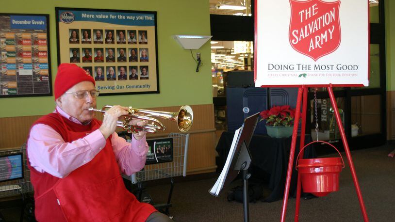Joe Pizza of Centerville plays “God Rest Ye Merry Gentlemen” at the Kroger Marketplace off State Route 48 in Centerville as a kettle volunteer for The Salvation Army. CONTRIBUTED PHOTO BY PAMELA DILLON