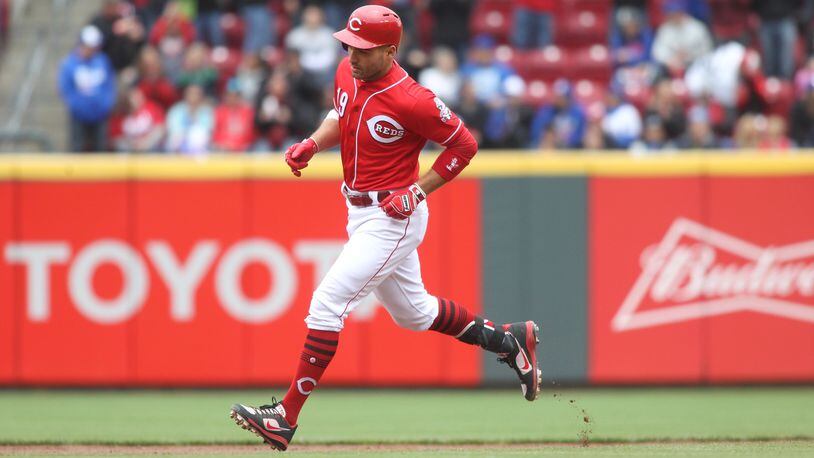 The Reds’ Joey Votto rounds the bases after a home run against the Cubs on Saturday, April 22, 2017, at Great American Ball Park in Cincinnati. David Jablonski/Staff