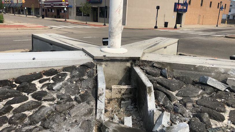 One person was taken to the hospital after a vehicle crashed into the Fairborn Veterans Memorial in downtown early Saturday morning, police said. NICK BLIZZARD/STAFF