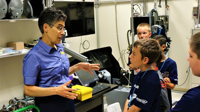 Dr. Barbara Shykoff, senior research engineer, answers questions from STARBASE participants during a recent visit to Naval Medical Research Unit-Dayton. Shykoff is standing in the physiology lab, which is where researchers are evaluating the impact of pressure in the aviation environment on the aviator’s respiratory physiology. (Contributed photo)
