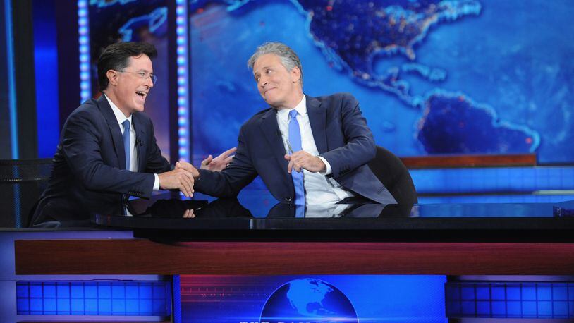 NEW YORK, NY - AUGUST 06: Stephen Colbert and Jon Stewart appear on "The Daily Show with Jon Stewart" #JonVoyage on August 6, 2015 in New York City. (Photo by Brad Barket/Getty Images for Comedy Central)