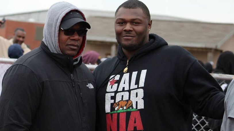 Former Ohio State and University of Kentucky lineman Marcelys Jones (right) stands with his uncle, Anthony Ross, a former Central State linebacker from the 1980s, during CSU’s spring football game Saturday. The 6-foot-4, 320-pound Jones is considering transferring to CSU and playing for the Marauders this season. CONTRIBUTED PHOTO