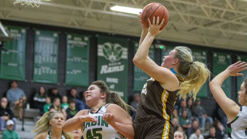 Alter's Maddie Moody shoots over Badin's Brooke Sebastian during Saturday night's game at Badin. CONTRIBUTED/Jeff Gilbert