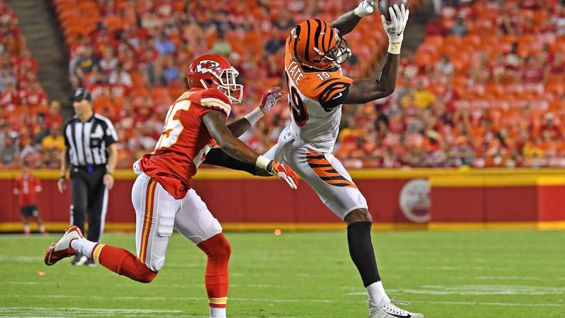 KANSAS CITY, MO - AUGUST 10: Auden Tate #19 of the Cincinnati Bengals catches a pass against Michael Hunter #25 of the Kansas City Chiefs in the fourth quarter during a preseason game at Arrowhead Stadium on August 10, 2019 in Kansas City, Missouri. (Photo by Peter Aiken/Getty Images)
