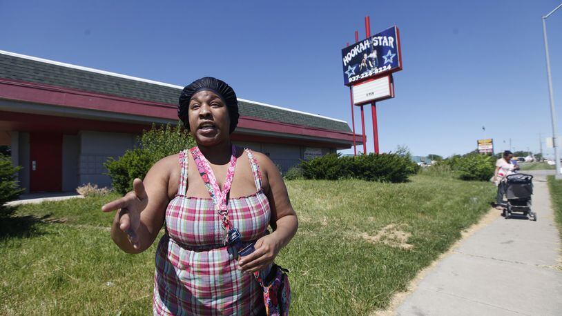 Crystal Newsome, 27, said she’s against a medical marijuana dispensary moving into her neighborhood. The site that was once the Hookah Star at 1875 Needmore Rd. was granted a license to sell medical marijuana on Monday. CHRIS STEWART / STAFF