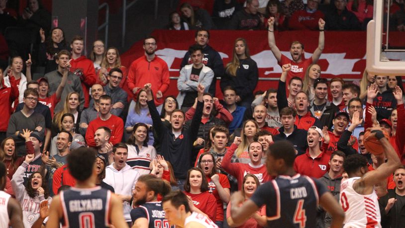 Fans in the Dayton student section cheer after a missed free throw by Richmond on Sunday, Jan. 6, 2019, at UD Arena. David Jablonski/Staff