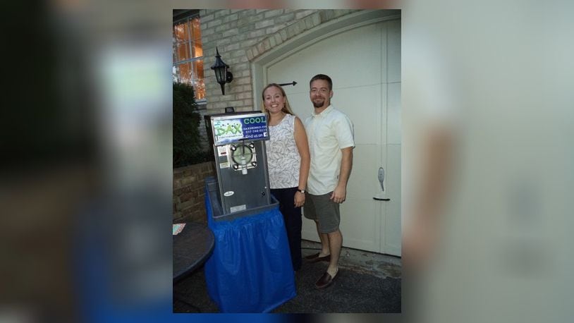 Oakwood residents Katherine and Jason Cezeaux come from Texas, where it was common to see a drink machine at parties. CONTRIBUTED
