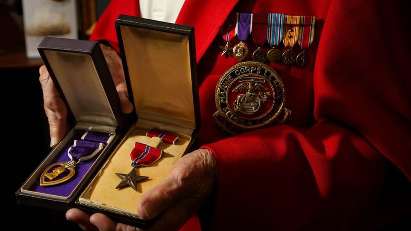 DETAIL: Jack Daugherty, a former Marine who was a medic at Iwo Jima and Guam in World War II with the medals he earned, the Bronze Star and Purple Heart. JIM WITMER/STAFF