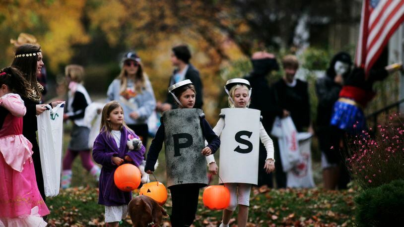 With trick-or-treaters expected to be out in smaller groups this year due to coronavirus, Ohio State Highway Patrol is reminding motorists and pedestrians to pay attention this Halloween. STAFF FILE PHOTO / JIM NOELKER