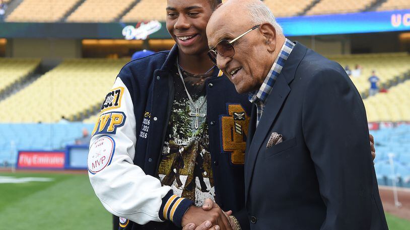 Reds' first-round draft choice Hunter Greene, a pitcher-shortstop from Stevenson Ranch, Calif., met Hall of Famer Don Newcombe during batting practice before a Dodgers game against the Phillies at Dodger Stadium on April 28.