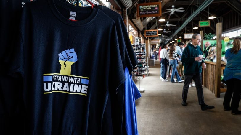 Ukraine tee shirts are being sold at the 2nd Street Market in Dayton. The market crowds are getting larger after two years of COVID restrictions. JIM NOELKER/STAFF