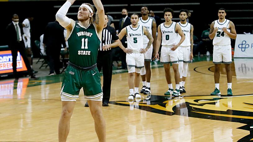 Cleveland State players watch as Wright State center Loudon Love shoots after a technical foul call during a Horizon League game at the Nutter Center in Fairborn Jan. 16, 2021. Wright State won 85-49. Contributed photo by E.L. Hubbard
