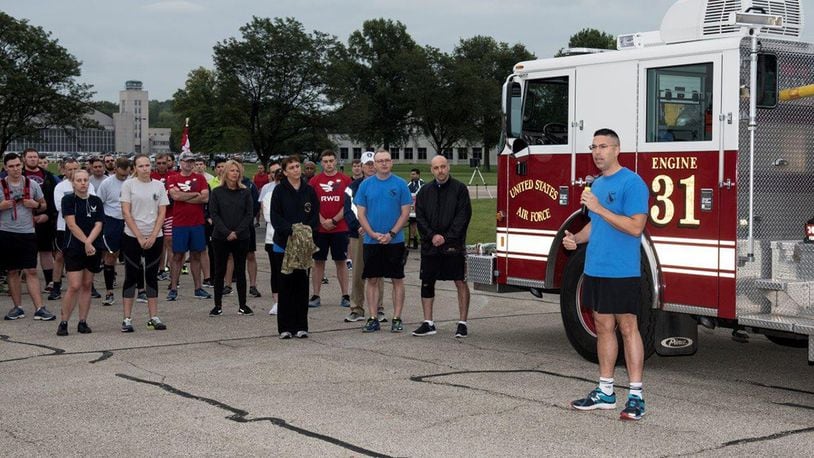 Col. Thomas P. Sherman, 88th Air Base Wing commander, makes welcoming comments prior to the start of the annual Run for the Fallen event at Wright-Patterson Air Force Base Sept. 11. Many members of the Wright-Patterson Air Force Base community took part in the 5K run commemorating the 17th anniversary of the 9/11 terrorist attacks. (U.S. Air Force photos/Michelle Gigante)