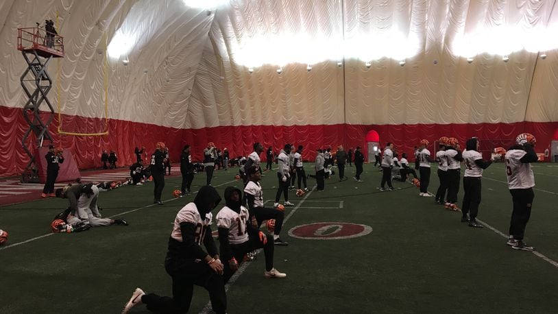 Cincinnati Bengals players stretch prior to the start of a practice in 2017 at the University of Cincinnati indoor facility. DAYTON DAILY NEWS FILE
