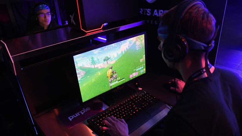 Gamers play "Fortnite" during Ninja Vegas '18 at Esports Arena Las Vegas at Luxor Hotel and Casino on April 21, 2018 in Las Vegas, Nevada.  In Jan. 2018, Florida authorities said a man used "Fortnite" to to solicit a child for pornographic images.