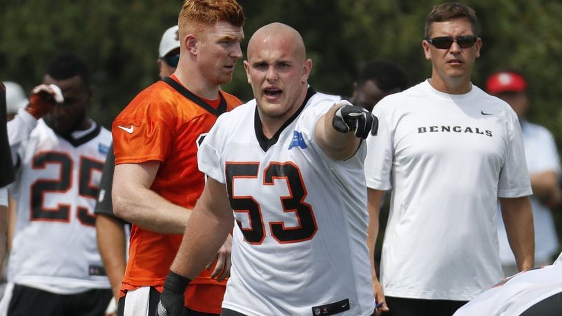 Cincinnati Bengals center Billy Price (53) signals to his players during NFL football practice, Thursday, July 26, 2018, in Cincinnati. (AP Photo/John Minchillo)