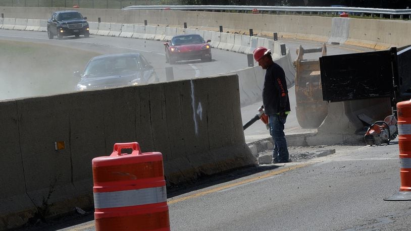 Work began in 2022 on the Harshman Road concrete wall separating traffic near Wright-Patterson Air Force Base and the National Museum of the U.S. Air Force in Riverside. MARSHALL GORBY/STAFF