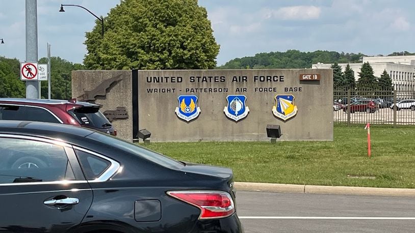 Vehicles leaving gate 1B at Wright-Patterson Air Force Base Tuesday afternoon. THOMAS GNAU/STAFF
