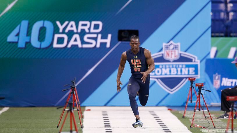 Wide receiver John Ross of Washington runs the 40-yard dash in a record time of 4.22 seconds during day four of the NFL Combine at Lucas Oil Stadium on March 4 in Indianapolis.