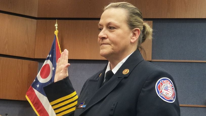Moraine Fire Chief Traci Kuzminski is sworn in during Moraine City Council's meeting Thursday, Feb. 8, 2024. Kuzminski has been with Moraine since 2004. CONTRIBUTED