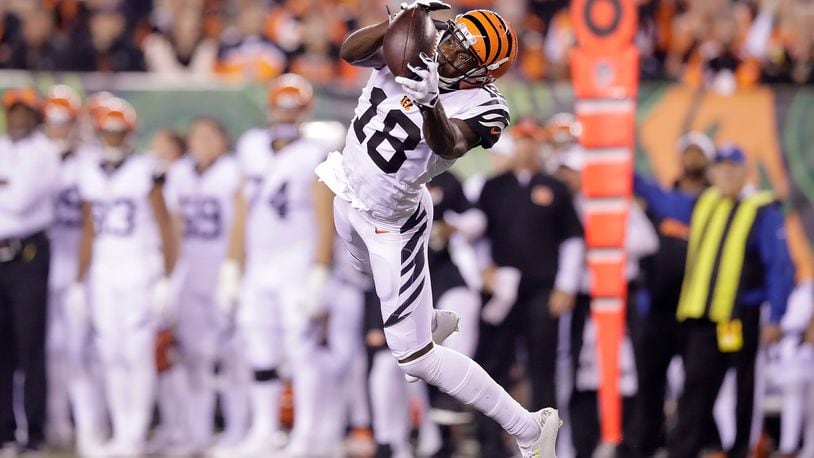 CINCINNATI, OH - SEPTEMBER 29: A.J. Green #18 of the Cincinnati Bengals catches a pass during the second quarter of the game against the Miami Dolphins at Paul Brown Stadium on September 29, 2016 in Cincinnati, Ohio. (Photo by Andy Lyons/Getty Images)