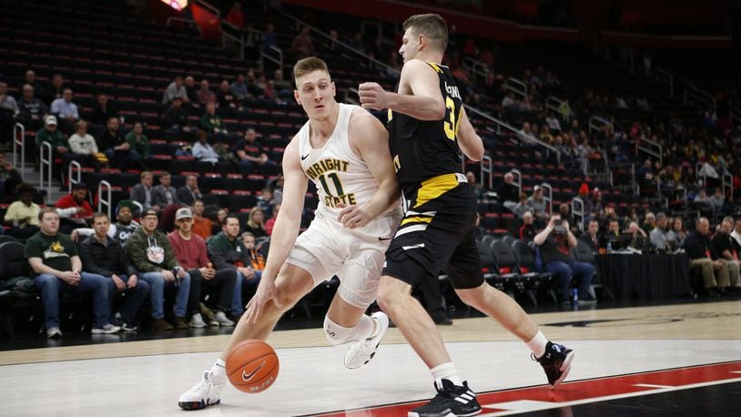 Wright State’s Loudon Love looks to drive past NKU’s Drew McDonald during the Horizon League championship game Tuesday, March 12, 2019, at Little Caesars Arena in Detroit. Jose Juarez/CONTRIBUTED