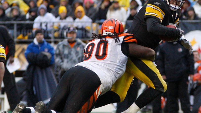 PITTSBURGH - DECEMBER 12: Ben Roethlisberger #7 of the Pittsburgh Steelers is sacked by Pat Sims #90 of the Cincinnati Bengals during the game on December 12, 2010 at Heinz Field in Pittsburgh, Pennsylvania. (Photo by Jared Wickerham/Getty Images)