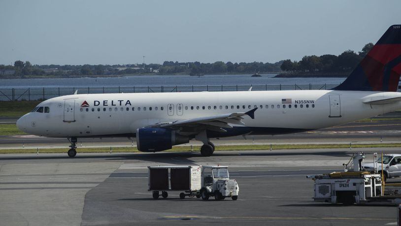 A Delta Airlines jet taxis on the runway at LaGuardia Airport in New York on Aug. 8, 2016. Bloomberg photo by Victor J. Blue.