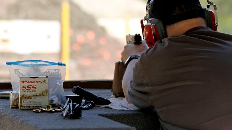 A patron shoots his Smith and Wesson at the Middletown Sportsman      Club's rifle and pistol range Wednesday, April 18, 2012 in      Middletown, Ohio. GARY STELZER / STAFF