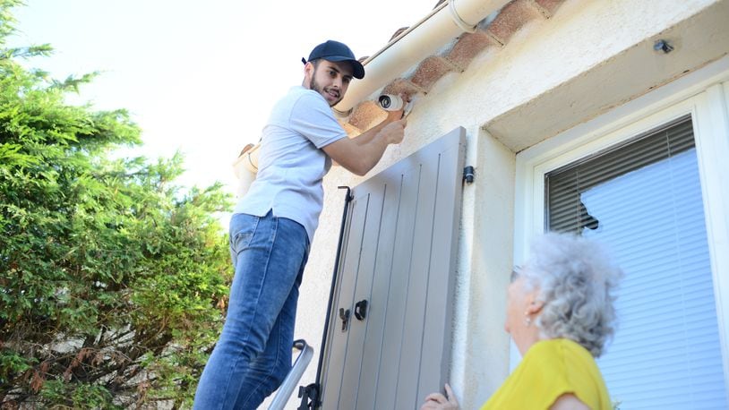 Investing in a smart security system is one of the things seniors living alone can do to protect themselves. SHUTTERSTOCK