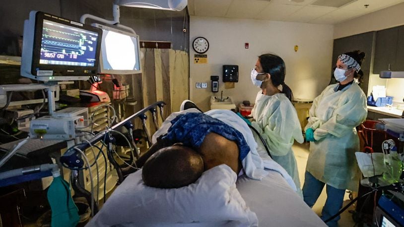 Dayton VA gastroenterology specialist Dr. Sangeeta Agrawal performs a colonoscopy on Army veteran Vincent Epps using AI technology to detect polyps in this December 2022 file photo. The registered nurse on the right is Karen Cockerham.
JIM NOELKER/STAFF