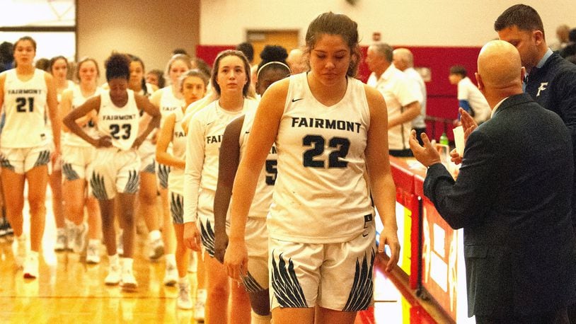 Fairmont senior Madison Bartley leads her team back to the bench Saturday after shaking hands with Mount Notre Dame. Fairmont lost 47-41 in the Division I region final at Princeton High School. Jeff Gilbert/CONTRIBUTED