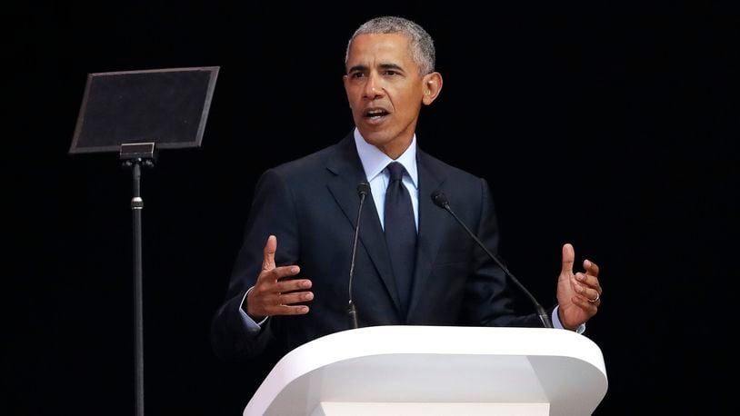Former U.S. President Barack Obama, left, delivers his speech at the 16th Annual Nelson Mandela Lecture at the Wanderers Stadium in Johannesburg, South Africa, Tuesday, July 17, 2018. In his highest-profile speech since leaving office, Obama urged people around the world to respect human rights and other values under threat in an address marking the 100th anniversary of anti-apartheid leader Nelson Mandela's birth.