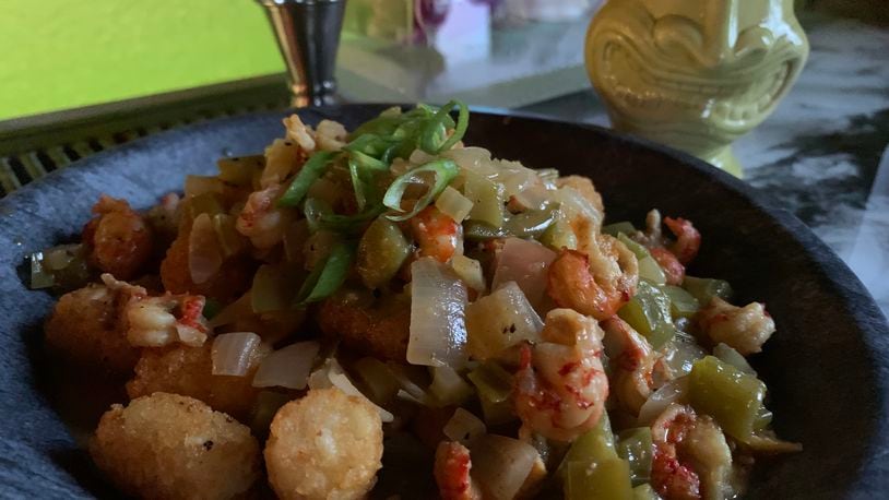 Crawfish Etoufée served over Tiki Tots ($16.95) at Backwater Voodoo in Miamisburg.