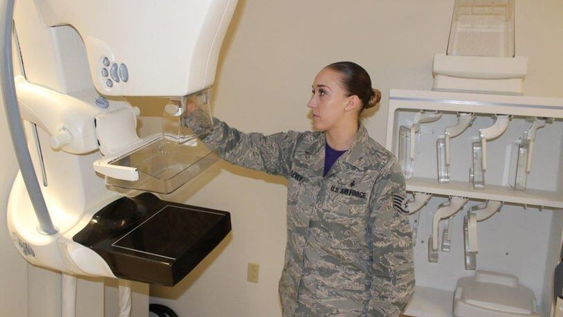 Staff Sgt. Lauren Le’vey, 88th Medical Group mammography course instructor, adjusts the mammogram machine for the next patient. According to the American College of Radiology, women should start having mammograms annually at the age of 40. Women who have immediate family members who had breast cancer should speak with their doctors about their risk and their potential need for additional screening. (U.S. Air Force photos/Stacey Geiger)