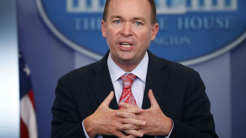 FILE - In this Thursday, July 20, 2017, file photo, Budget Director Mick Mulvaney gestures as he speaks during the daily press briefing at the White House in Washington. Mulvaney and Treasury Secretary Steven Mnuchin sent mixed signals Sunday, Nov. 19, on the fate of a health care provision in the Senate version of a $1.5 trillion measure to overhaul business and personal income taxes that is expected to be voted on after Thanksgiving. “I don’t think anybody doubts where the White House is on repealing and replacing Obamacare. We absolutely want to do it,” Mulvaney said. (AP Photo/Pablo Martinez Monsivais, File)